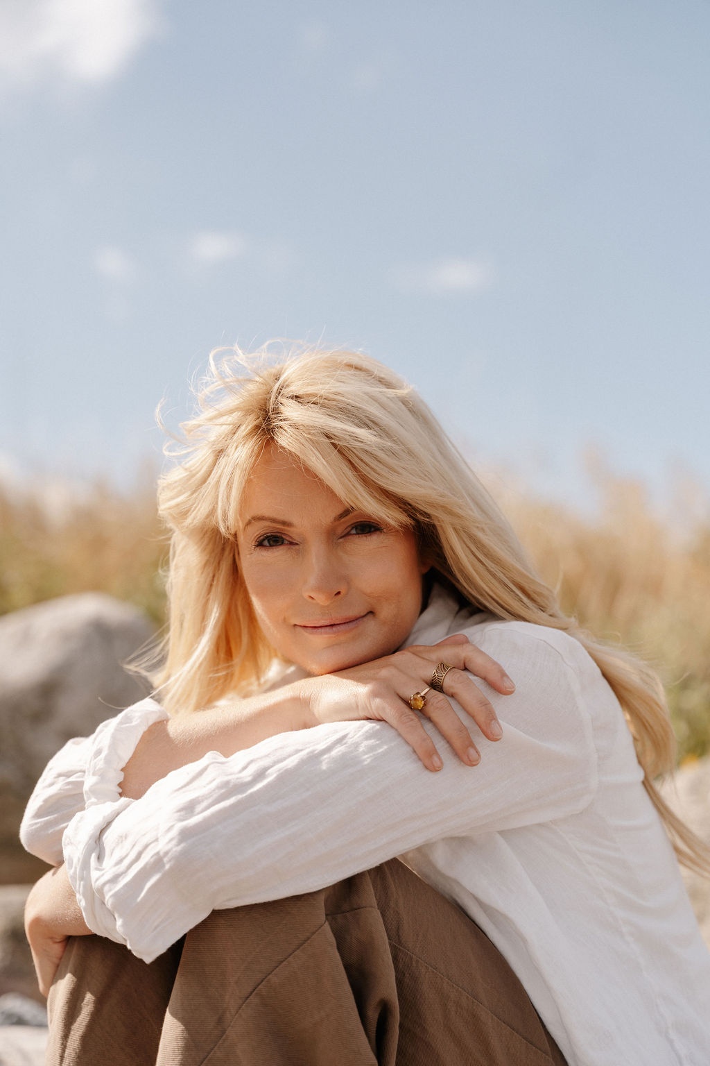     Linnea Leth, Swedish model, in white shirt outdoors by the Swedish coast